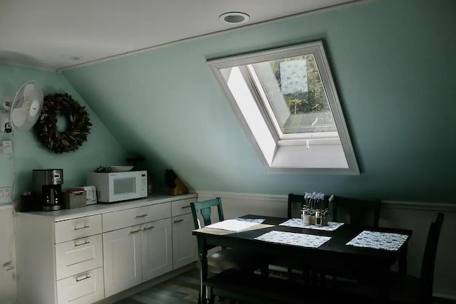 dining space featuring lofted ceiling