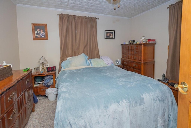 bedroom with light carpet, ornamental molding, and an ornate ceiling