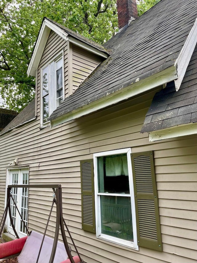 642 Main St, Old Town, ME 04468 - view of home's exterior featuring roof with shingles and a chimney