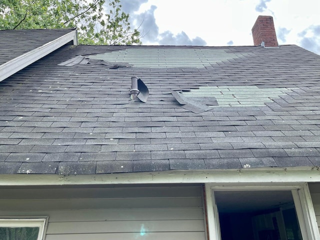 642 Main St, Old Town, ME 04468 - exterior details featuring roof with shingles and a chimney