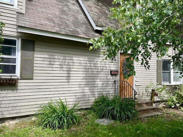 642 Main St, Old Town, ME 04468 - property entrance featuring a shingled roof