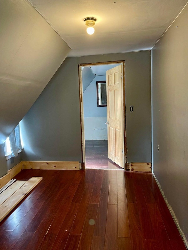 642 Main St, Old Town, ME 04468 - additional living space with hardwood / wood-style floors, baseboards, and vaulted ceiling