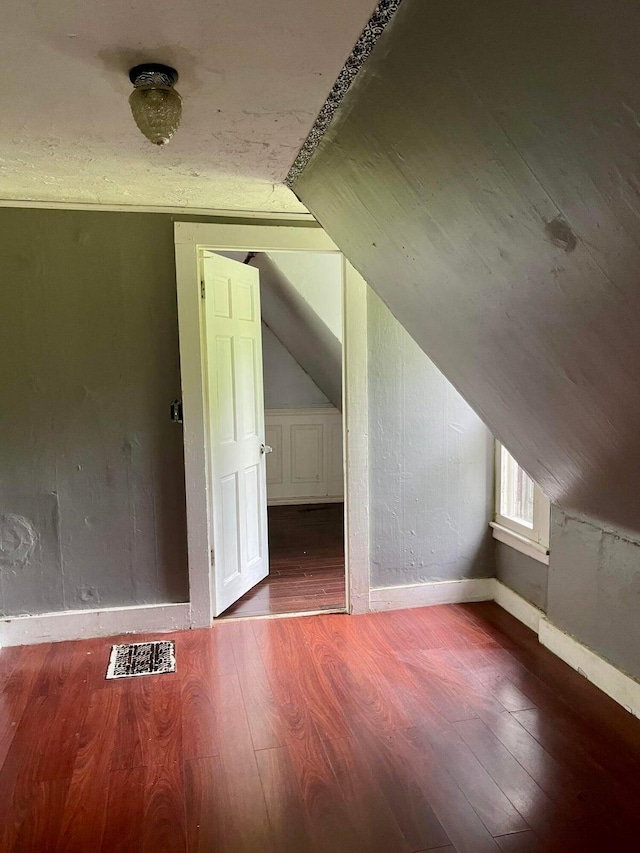 642 Main St, Old Town, ME 04468 - bonus room with wood finished floors, baseboards, vaulted ceiling, and visible vents
