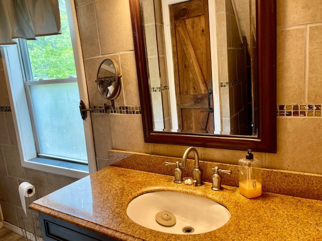 642 Main St, Old Town, ME 04468 - bathroom featuring vanity and tile walls