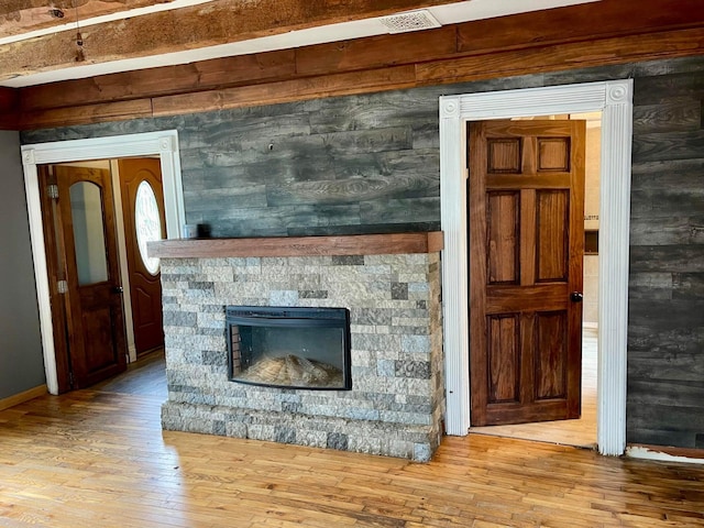 642 Main St, Old Town, ME 04468 - unfurnished living room featuring hardwood / wood-style floors and a fireplace