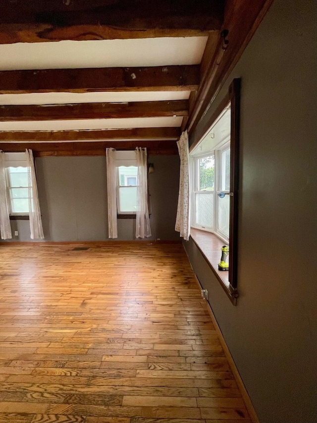 642 Main St, Old Town, ME 04468 - unfurnished room featuring wood-type flooring and beam ceiling