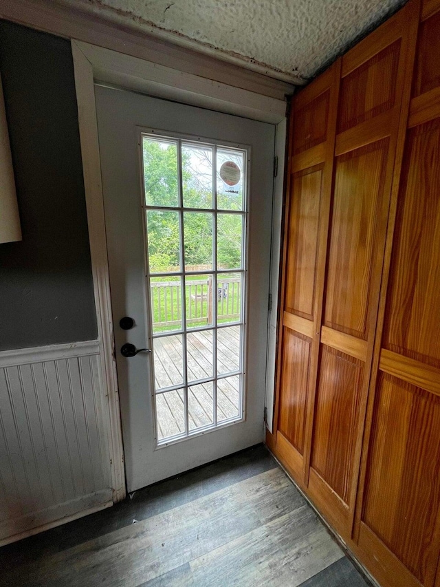 642 Main St, Old Town, ME 04468 - entryway with light wood-style flooring, a healthy amount of sunlight, and a wainscoted wall