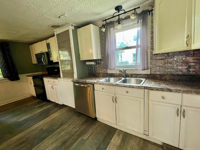 642 Main St, Old Town, ME 04468 - kitchen with dark wood-style flooring, a textured ceiling, white cabinets, appliances with stainless steel finishes, and a sink