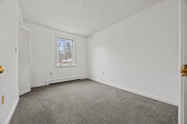 unfurnished bedroom featuring baseboards, a textured ceiling, carpet, and baseboard heating