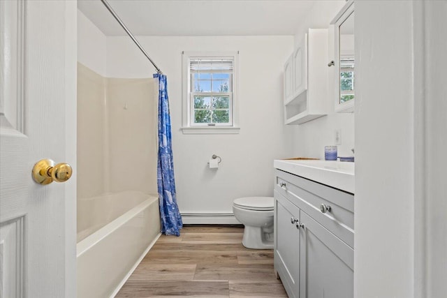 full bathroom featuring shower / bath combination with curtain, vanity, toilet, wood finished floors, and a baseboard radiator