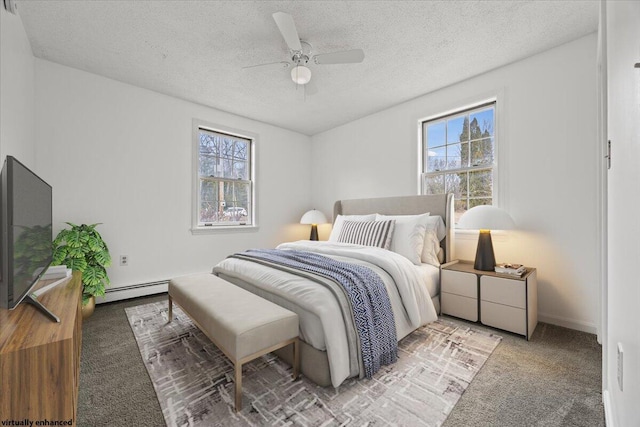 bedroom with a baseboard radiator, multiple windows, carpet, and a textured ceiling