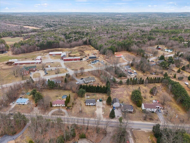 birds eye view of property with a wooded view