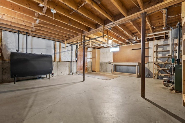 basement featuring a heating unit and heating fuel