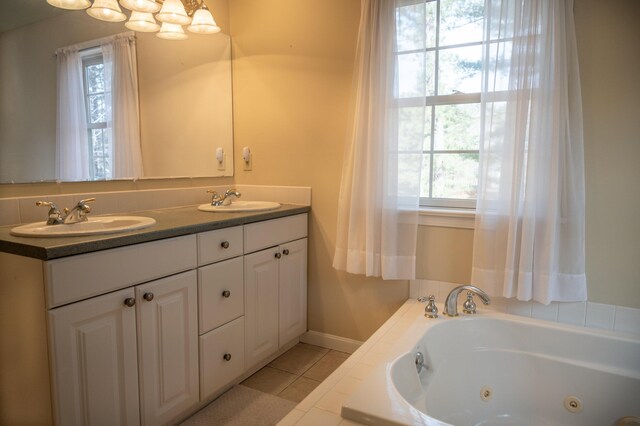 21 Oakmont Dr Unit 21, Old Orchard Beach, ME 04064 - bathroom with double vanity, tile patterned floors, a tub with jets, and a sink