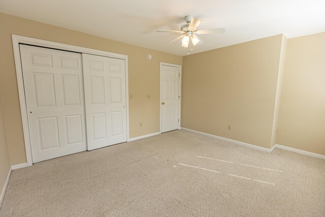 21 Oakmont Dr Unit 21, Old Orchard Beach, ME 04064 - unfurnished bedroom featuring light carpet, a closet, and baseboards