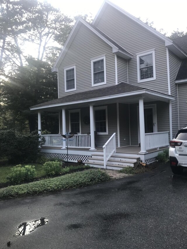 21 Oakmont Dr Unit 21, Old Orchard Beach, ME 04064 - farmhouse with a shingled roof and covered porch