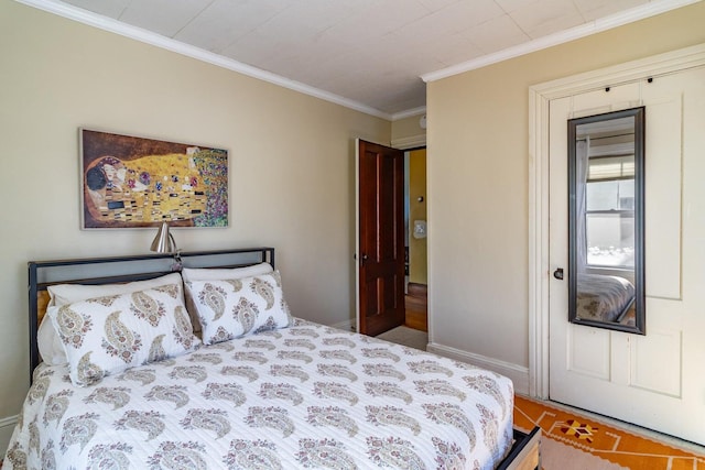 bedroom with crown molding and baseboards