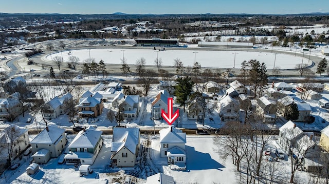 snowy aerial view featuring a residential view