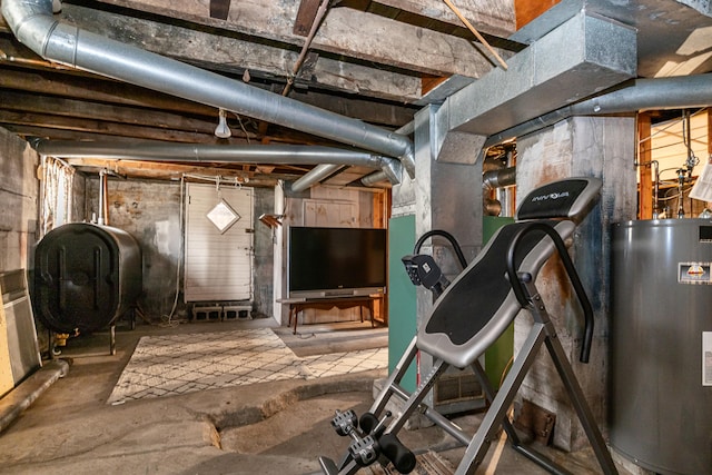 unfinished basement featuring water heater and heating fuel