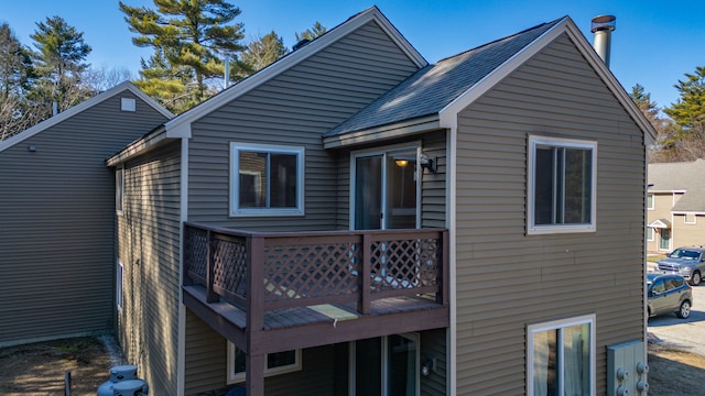 back of property with a wooden deck