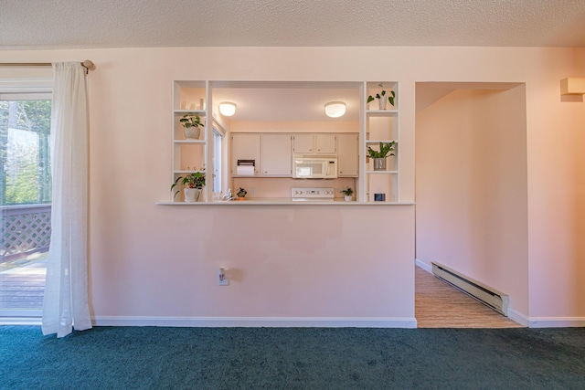 kitchen with open shelves, a baseboard heating unit, light countertops, white microwave, and light colored carpet