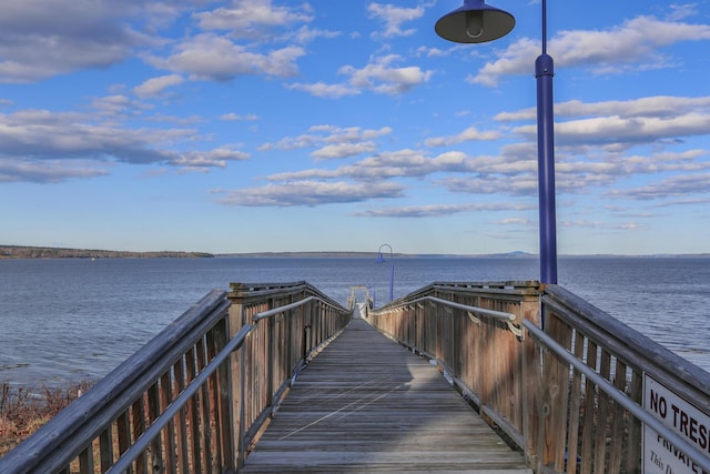 surrounding community with a water view