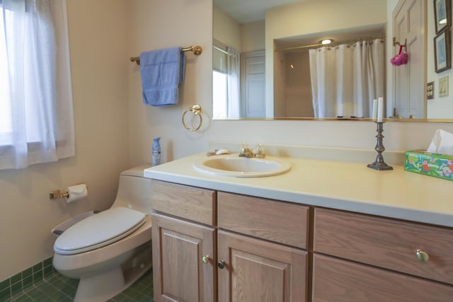 full bath featuring toilet, curtained shower, tile patterned flooring, and vanity