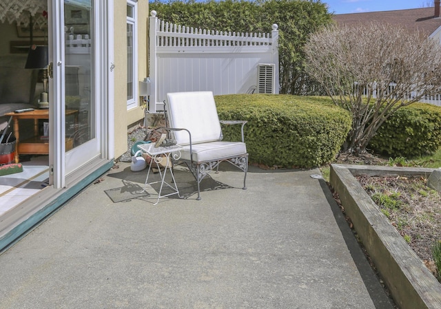 view of patio / terrace featuring fence