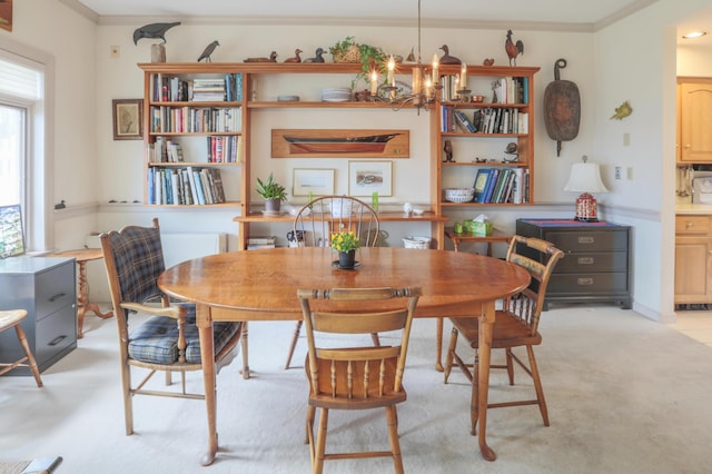 dining space with crown molding and an inviting chandelier