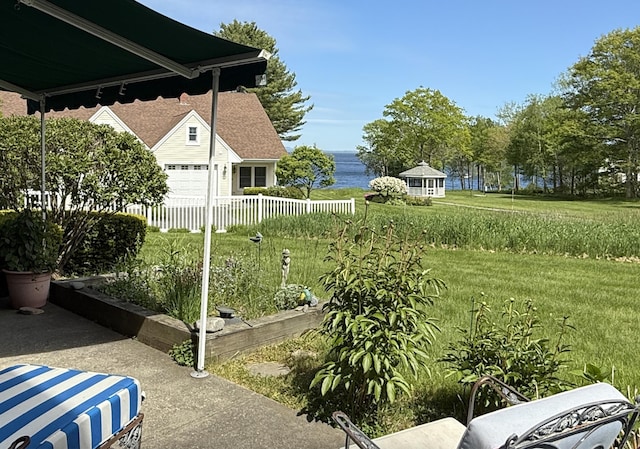 91 Dockside Ln Unit 5, Belfast, ME 04915 - view of yard with a water view and a garage