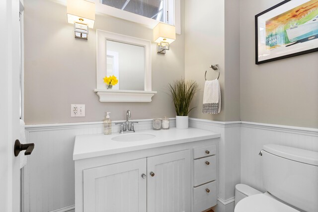 21 Atlantic St, Rockland, ME 04841 - bathroom featuring toilet, a wainscoted wall, and vanity