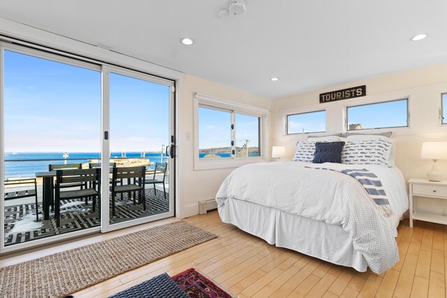 21 Atlantic St, Rockland, ME 04841 - bedroom with access to outside, recessed lighting, a water view, a baseboard heating unit, and light wood finished floors