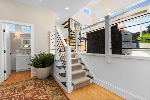 21 Atlantic St, Rockland, ME 04841 - stairs featuring recessed lighting, wood-type flooring, and a wealth of natural light