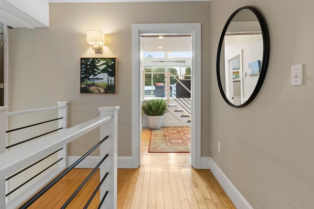21 Atlantic St, Rockland, ME 04841 - hallway featuring an upstairs landing, light wood-style flooring, and baseboards