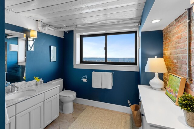21 Atlantic St, Rockland, ME 04841 - bathroom with tile patterned floors, vanity, baseboards, and toilet