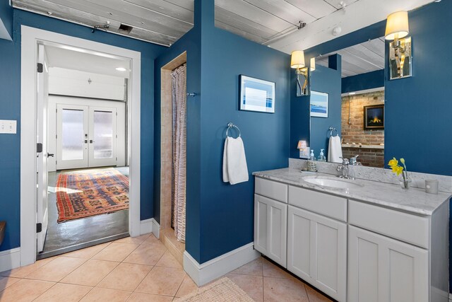 21 Atlantic St, Rockland, ME 04841 - full bath with vanity, walk in shower, tile patterned floors, french doors, and baseboards