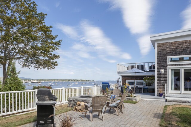21 Atlantic St, Rockland, ME 04841 - view of patio featuring a water view, fence, and a fire pit
