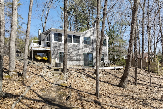 27 Miller Ln, Alfred, ME 04002 - view of side of home featuring a chimney, a wooden deck, central AC unit, and stairs