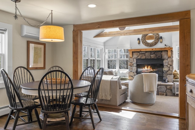 27 Miller Ln, Alfred, ME 04002 - dining space featuring recessed lighting, vaulted ceiling with beams, hardwood / wood-style floors, a fireplace, and a wall unit AC