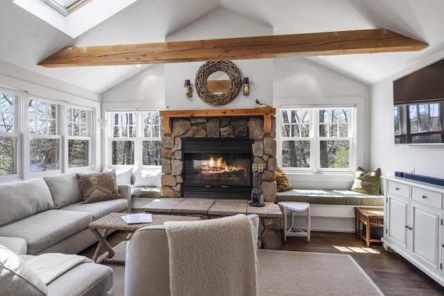 27 Miller Ln, Alfred, ME 04002 - living room featuring lofted ceiling with skylight, dark wood-style flooring, a wealth of natural light, and a fireplace