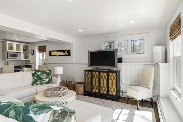27 Miller Ln, Alfred, ME 04002 - living area featuring recessed lighting, a wainscoted wall, baseboard heating, and wood finished floors