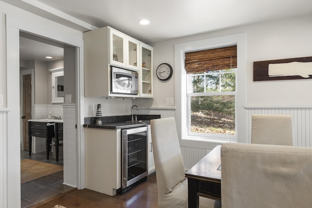27 Miller Ln, Alfred, ME 04002 - bar with stainless steel microwave, indoor wet bar, a sink, wine cooler, and a wainscoted wall