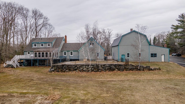 481 Washington Rd, Jefferson, ME 04348 - rear view of property featuring an outdoor structure, a yard, a chimney, and a deck