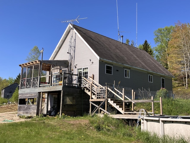 44 Webb Pond Rd, Eastbrook, ME 04634 - rear view of property with a deck and a sunroom