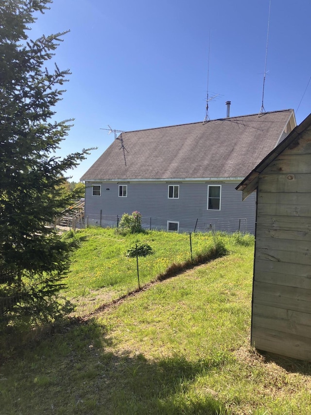 44 Webb Pond Rd, Eastbrook, ME 04634 - rear view of house featuring a yard