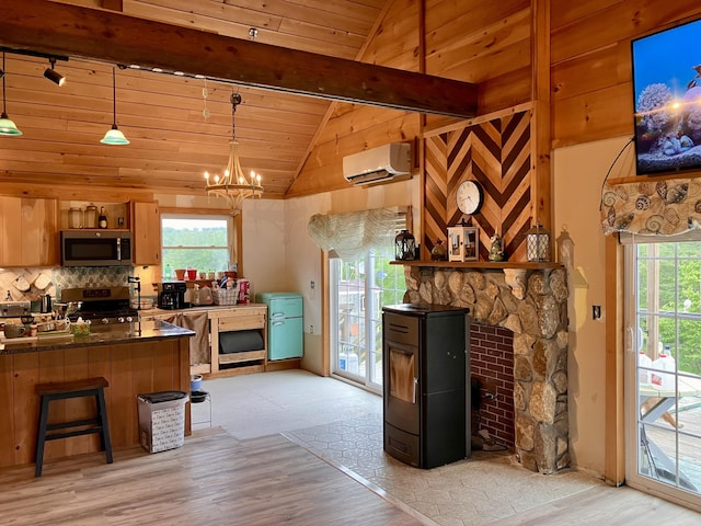 44 Webb Pond Rd, Eastbrook, ME 04634 - kitchen with stainless steel appliances, a wall mounted air conditioner, dark countertops, light wood-type flooring, and wood ceiling