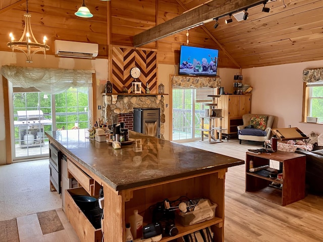 44 Webb Pond Rd, Eastbrook, ME 04634 - kitchen with a wall mounted AC, open shelves, stainless steel microwave, rail lighting, and wooden ceiling