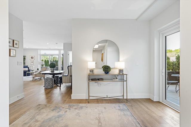 foyer with baseboards, recessed lighting, and hardwood / wood-style floors