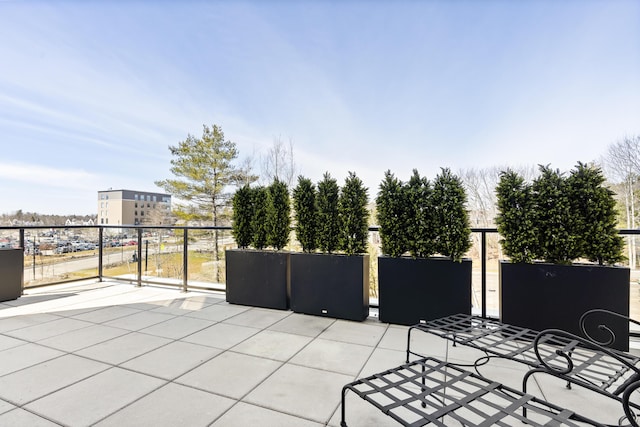 view of patio featuring a balcony
