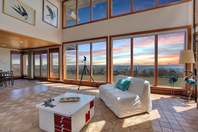 683 Kings Hwy, Kennebunkport, ME 04046 - living room with a water view, tile patterned floors, and a towering ceiling